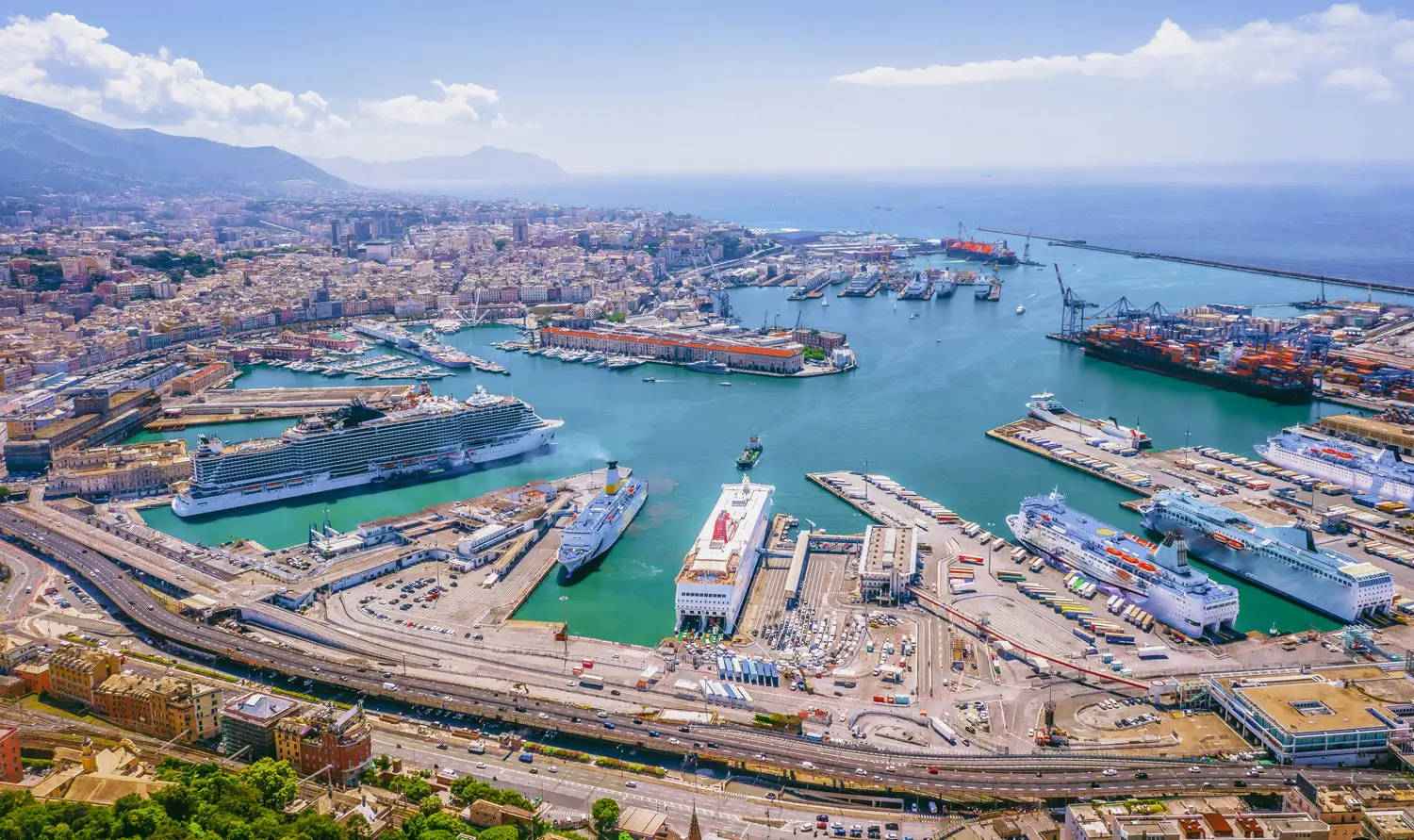 Container ships and passenger vessels in a major European port, illustrating EU ETS coverage and the growing importance of energy efficiency in shipping.
